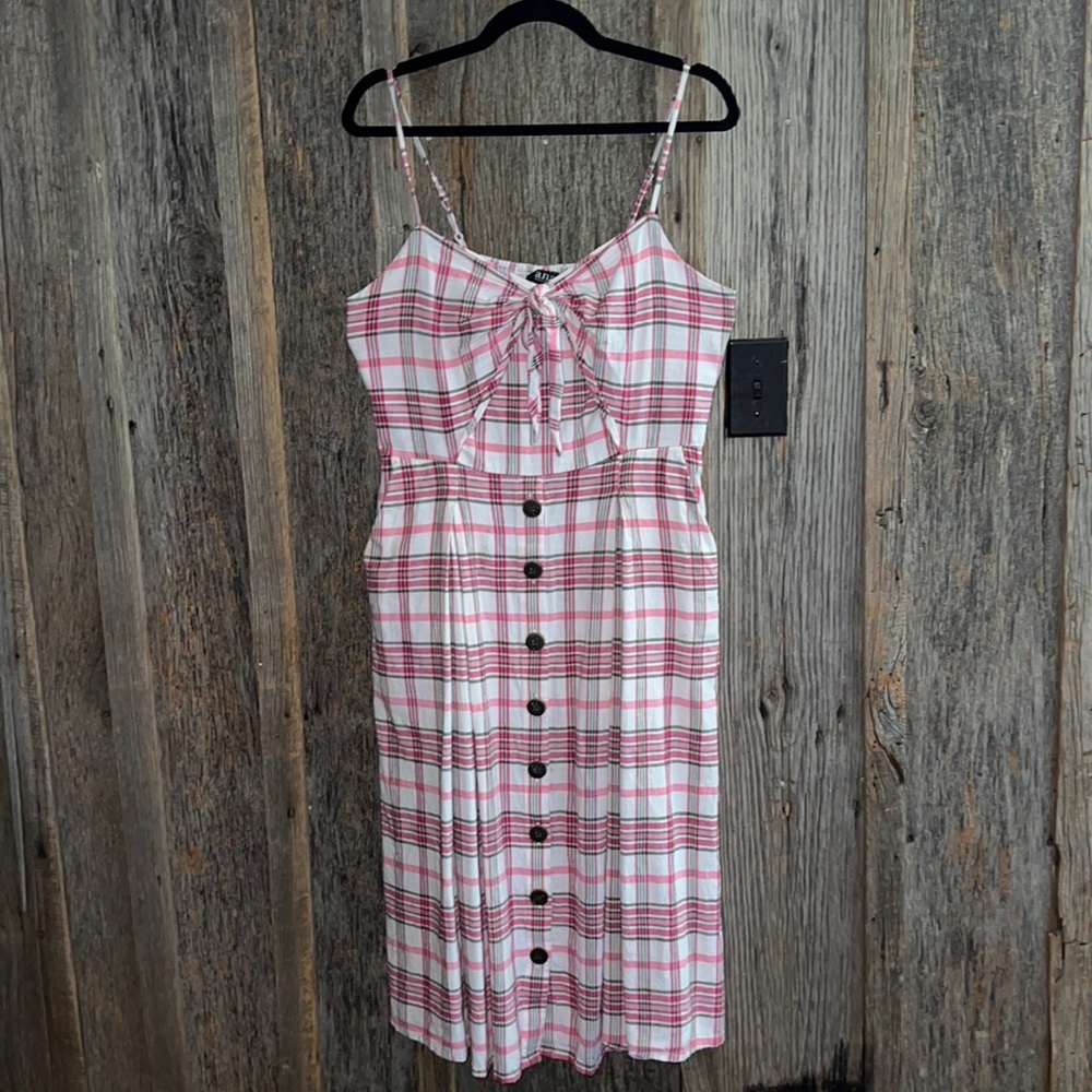 Cute summer dress; can wear into fall with a cardigan.